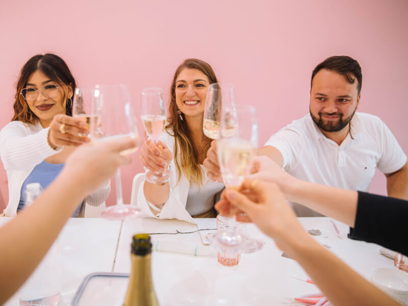 People raising their glasses up